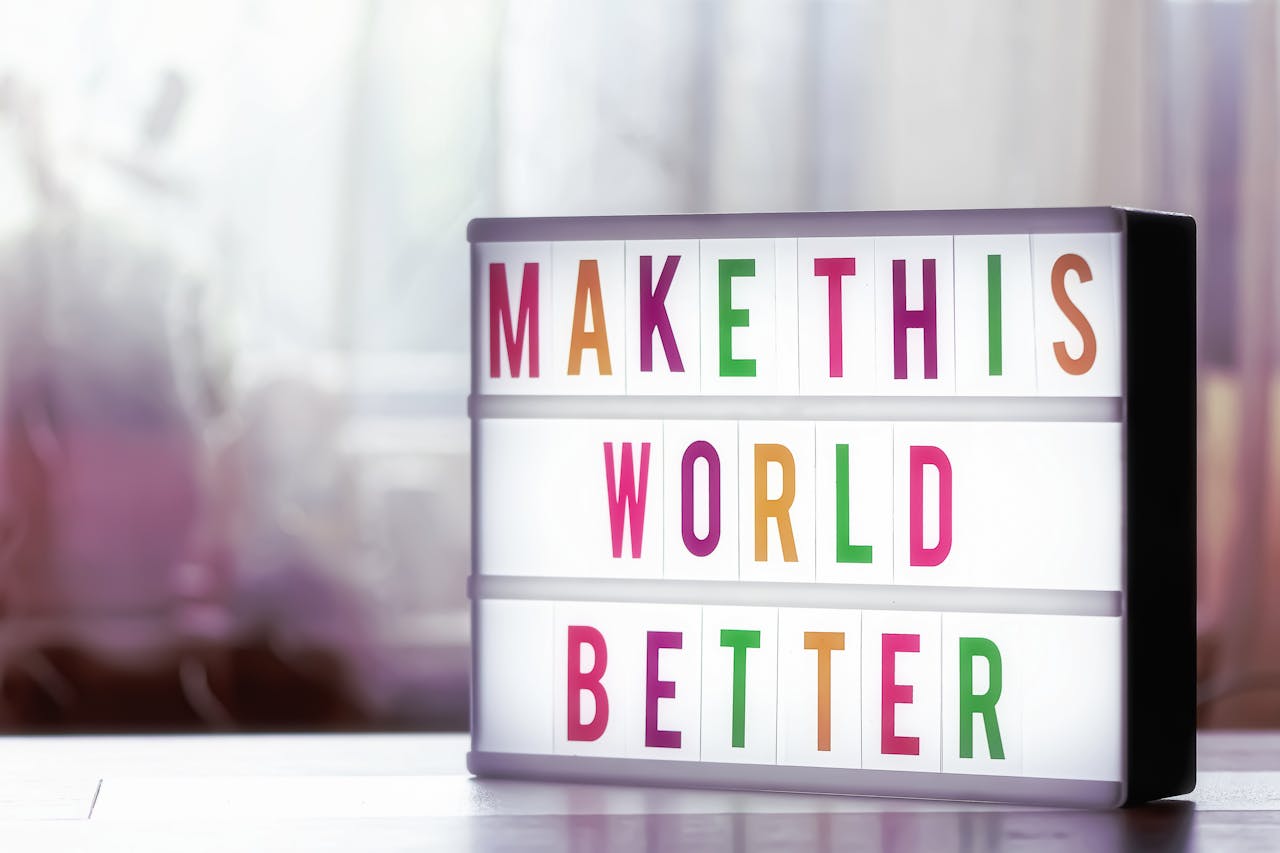 our-story Motivational lightbox with the message Make This World Better against a soft blurred background.